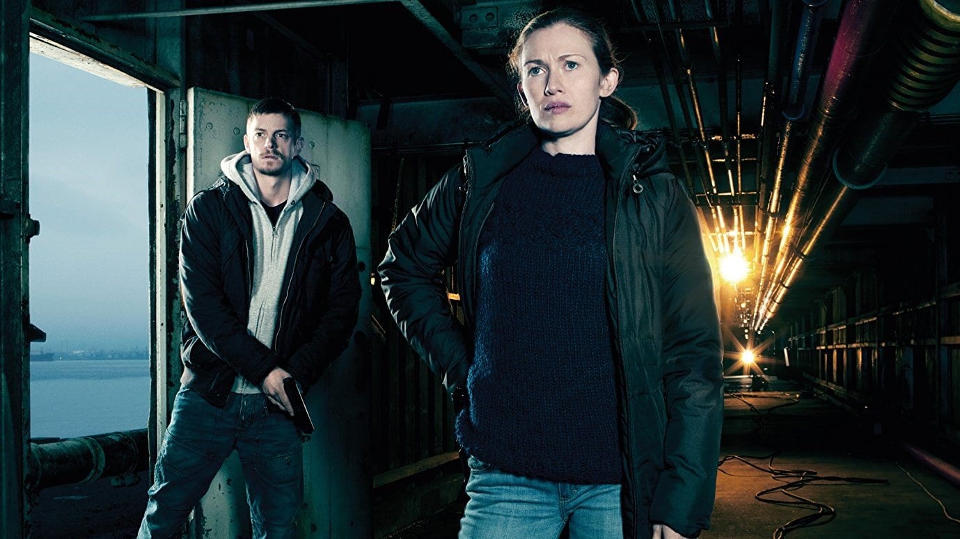 Linden and Holder in the first season of The Killing barging into a warehouse investigating a murder