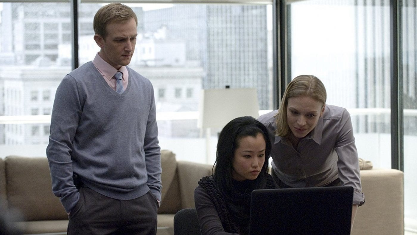 Jamie Wright and Gwen Eaton look at a laptop screen in The Killing