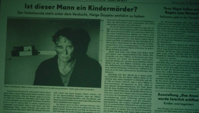 A newspaper with a picture of Ulrich that says "Ist dieser Mann ein Kindermorder?" in Dark on Netflix