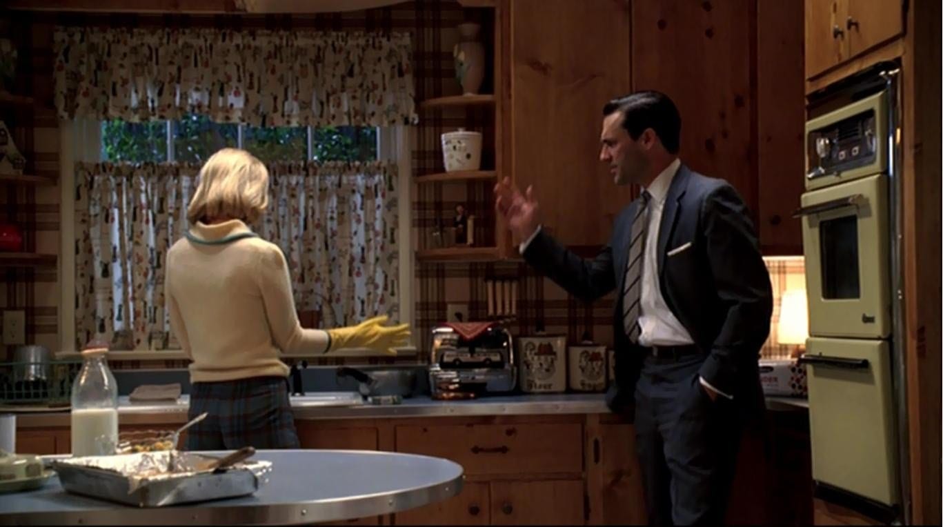 Betty and Don Draper argue in their kitchen