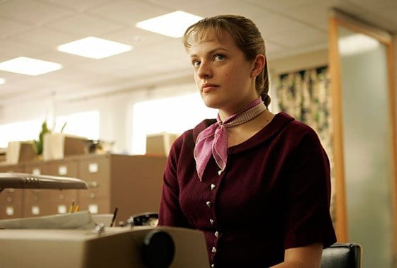 Peggy Olson sits at a typewriter in Mad Men