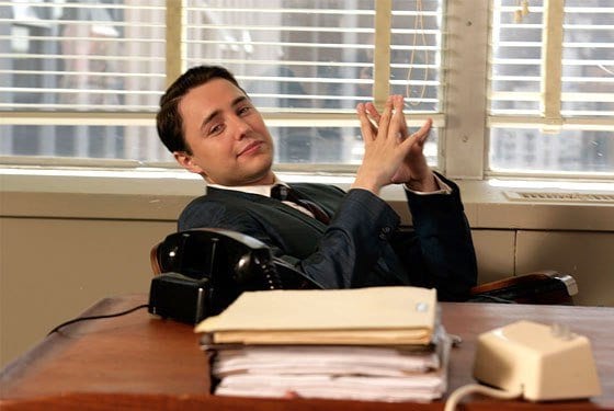 Pete Campbell lies back in his office chair with a smug grin in Mad Men