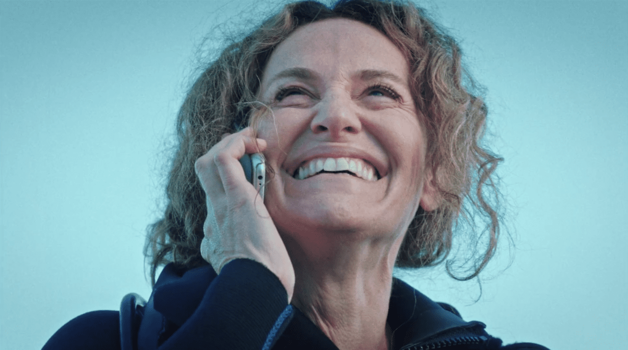 Laurie Garvey smiles on the phone in HBO's The Leftovers