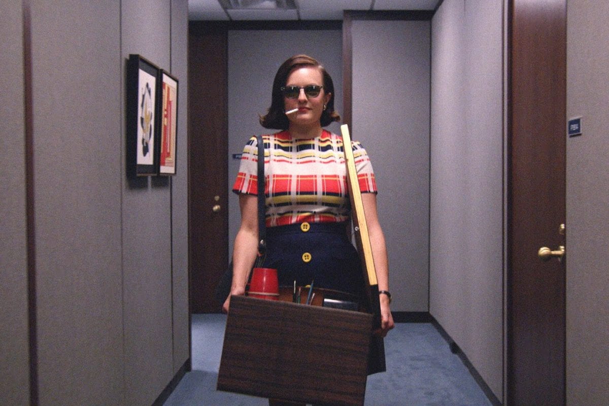 peggy looks cool wearing shades and smoking as she clears her desk