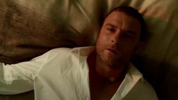 Ray Donovan lies on a bed