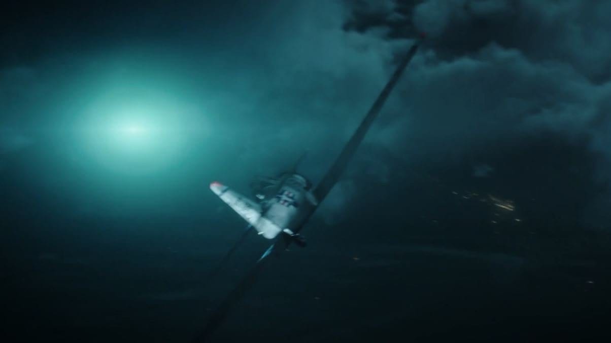 This image shows character pilot Fuller flying a P-51 Mustang with the bright blue light to the left representing the unidentified flying object he reported.