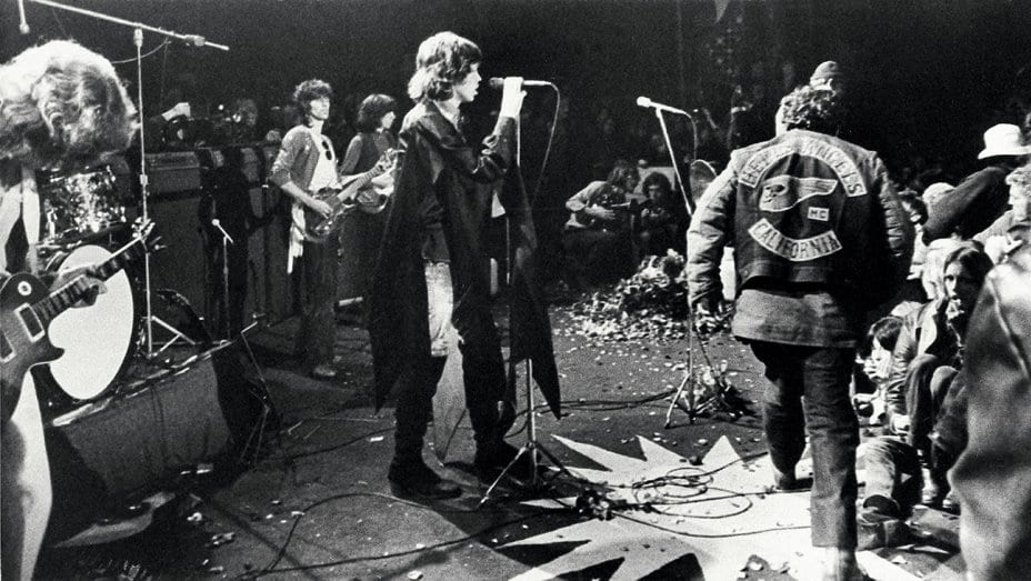 The Rolling Stones play at Altamont while the Hells Angels disrupt the show.