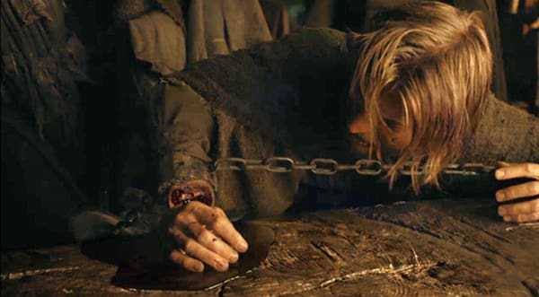 Jamie Lannister (Nikolaj Coster-Waldau) prepares to lose the hand that made him the Kingslayer. 