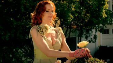 A woman holds a flower in Desperate Housewives