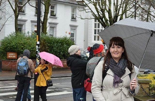 lindsay stamhuis stands in front of the abbey road zebra crossing
