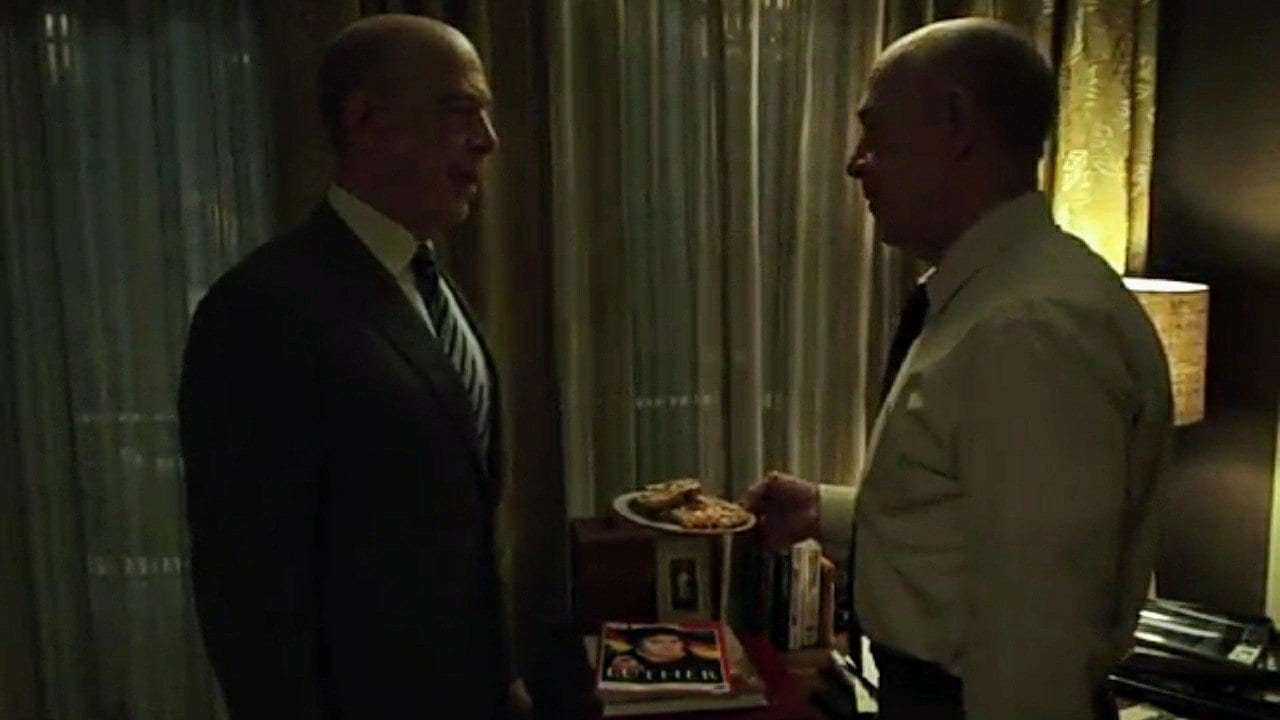 Counterpart - Howard tries to get Howard Prime to try something from the bakery downstairs