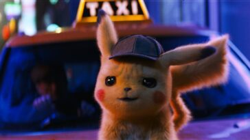 Pikachu pictued in front of a taxi in Detective Pikachu