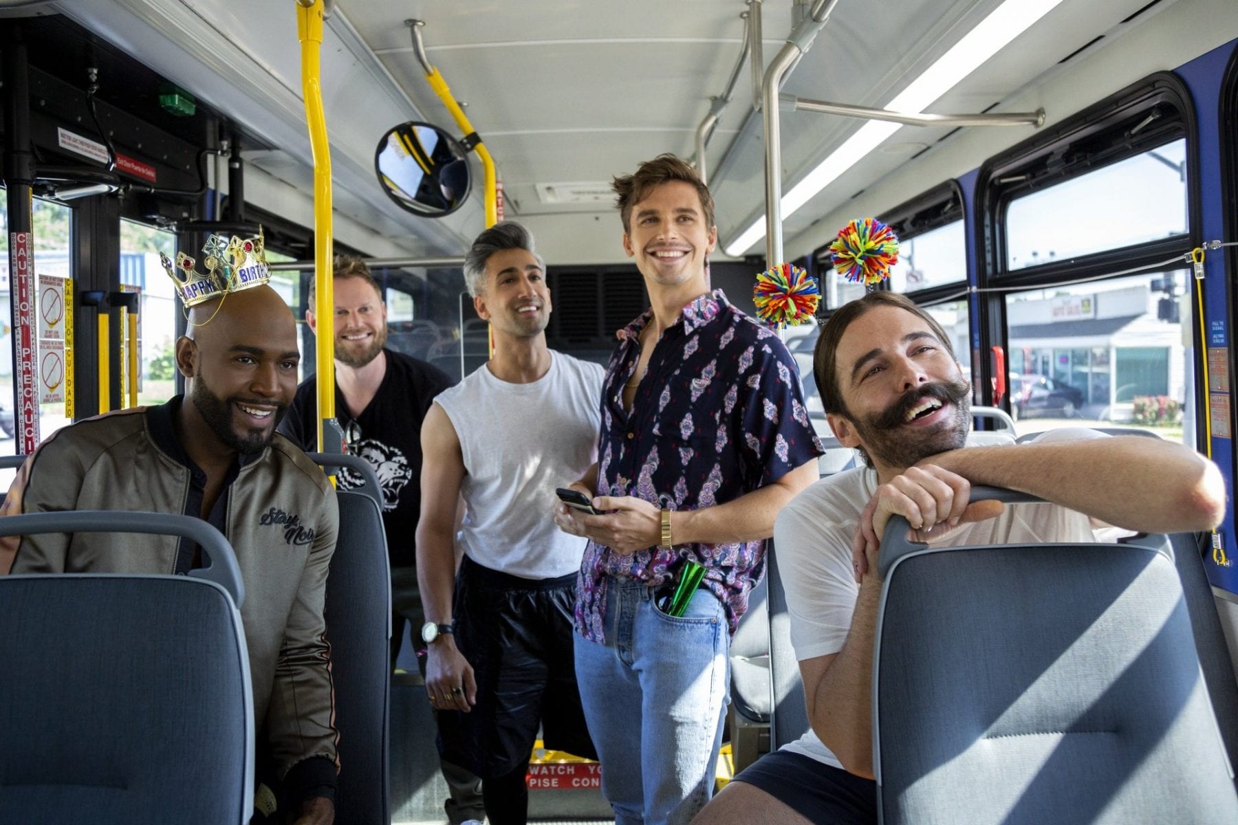 Karamo, Bobby, Tan, Antoni, and JVN on a bus in an episode of Queer Eye