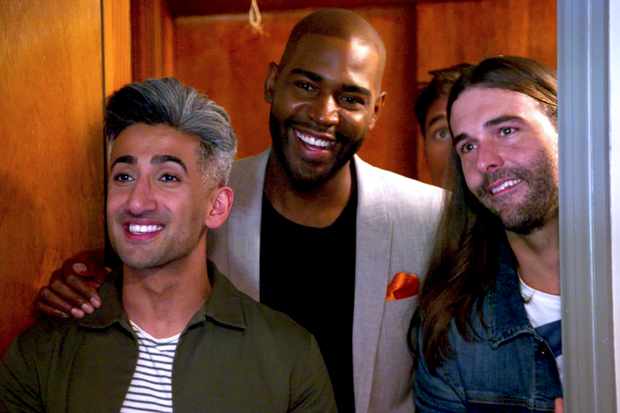 Tan, Karamo, and Anthony stand in a doorway, Anthony cries