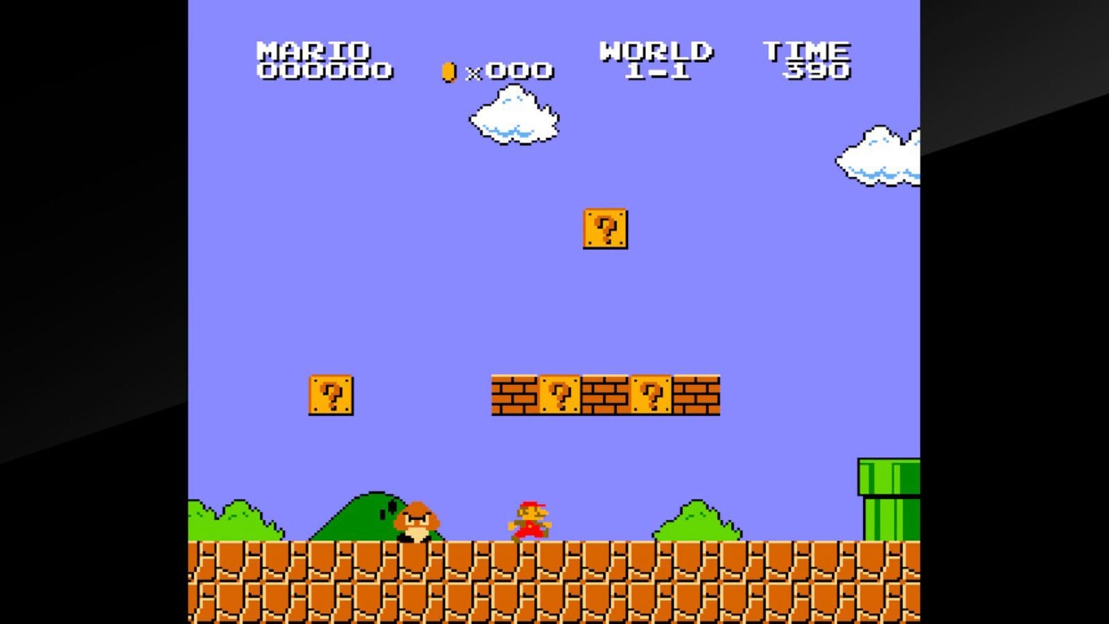 A typical scene in Super Mario Brothers, with Mario running along a course made of bricks, bad guys, and obstacles.