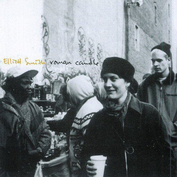 The cover for Elliot Smith Roman Candle is a candid shot of the singer holding a coffee cup, a picture he chose for its authenticity.