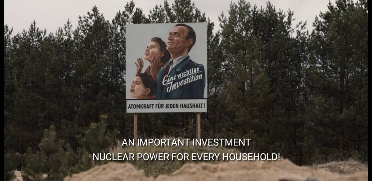 A sign next to a forest showing a nuclear family in Netflix's Dark