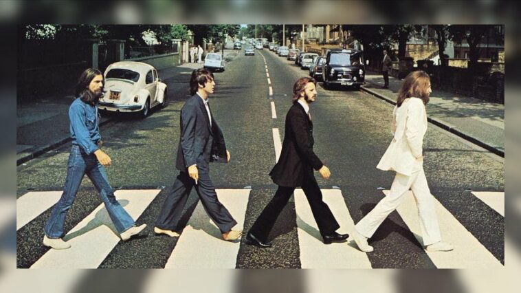 The Beatles George Harrison Paul McCartney Ringo Starr John Lennon walk across the Abbey Road zebra crossing
