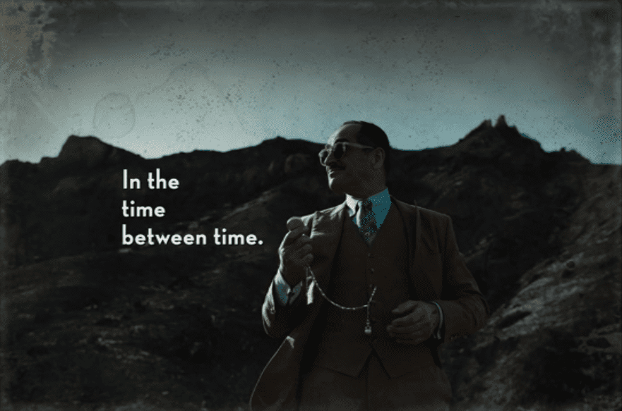 Farouk says they are in between time while he holds his pocketwatch and looks off into the distance while standing in front of a mountain