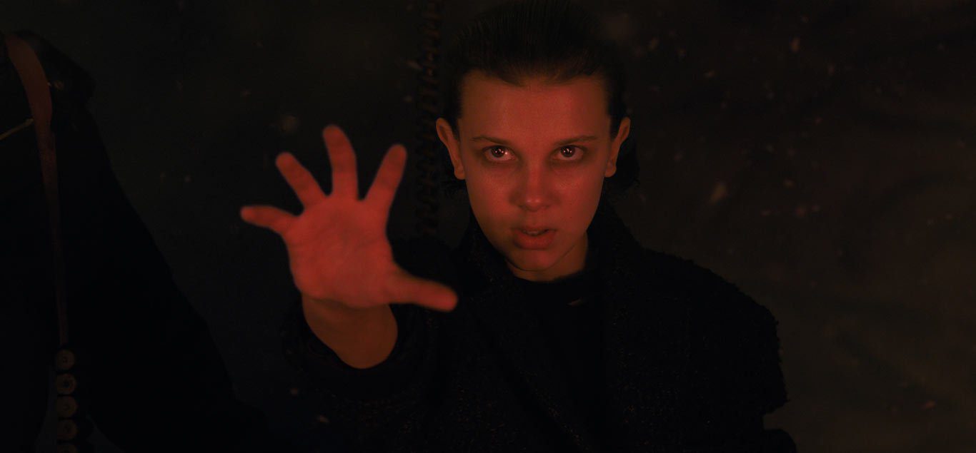 Hand outstretched, Eleven uses her powers to close the gate to the Upside Down