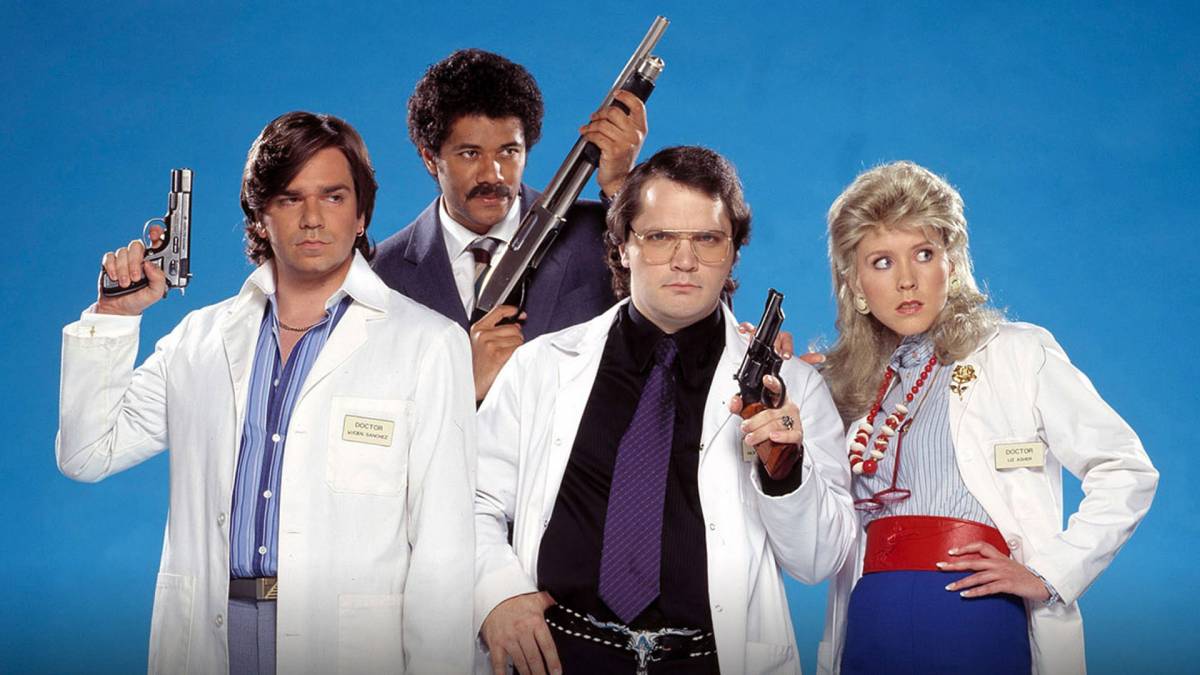 Principal cast pose with weapons in Garth Marenghi's Darkplace