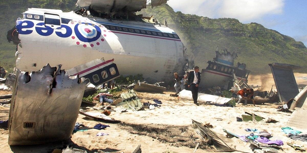 Jack stands in front of the wreckage of the plane on the beach in the pilot episode of Lost