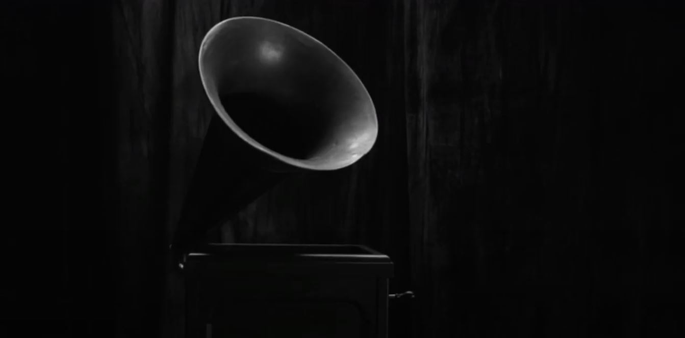 A phonograph in black and white in front of a curtain in Twin Peaks