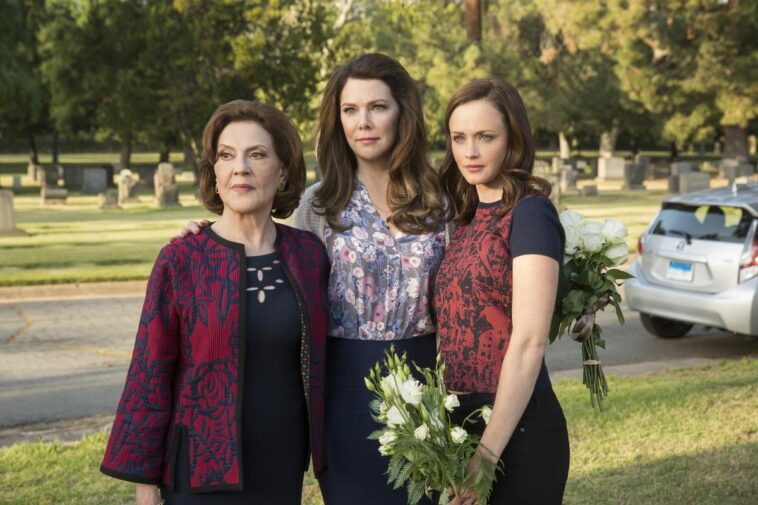Emily, Lorelai and Rory Gilmore stand at the graveyard
