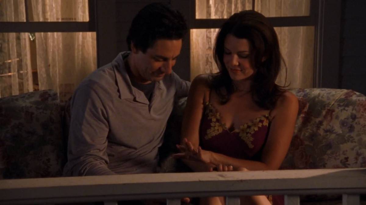 Max and Lorelai look down at the engagement ring on her hand