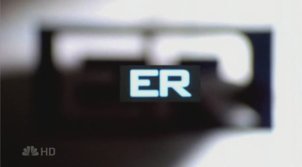 the ER title card, gray background with capital boldface letters ER in the center.