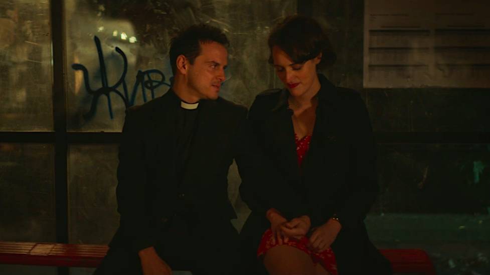 Fleabag and The Priest sit at the bus stop after she tells him she loves him