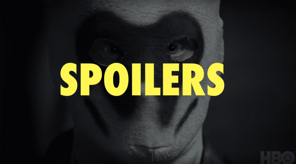 Man in a Rorschach mask with the word "Spoilers" over the face