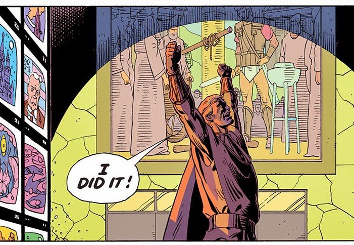 Image of Ozymandias standing in front of television screens in DC Comic yelling triumphantly, I did it!