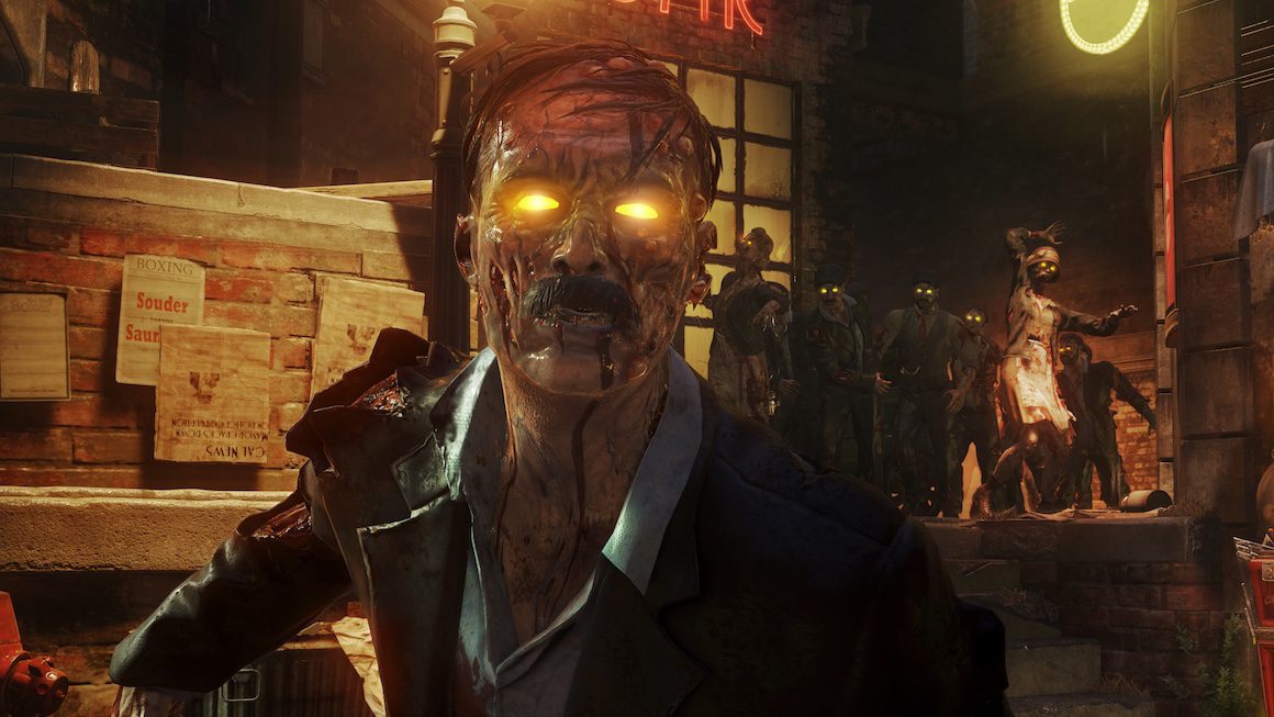 A zombie Hitler lurches toward the camera as other zombies follow behind