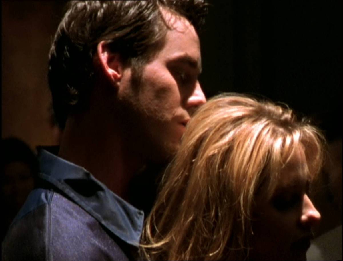 Buffy dances seductively with Xander.
