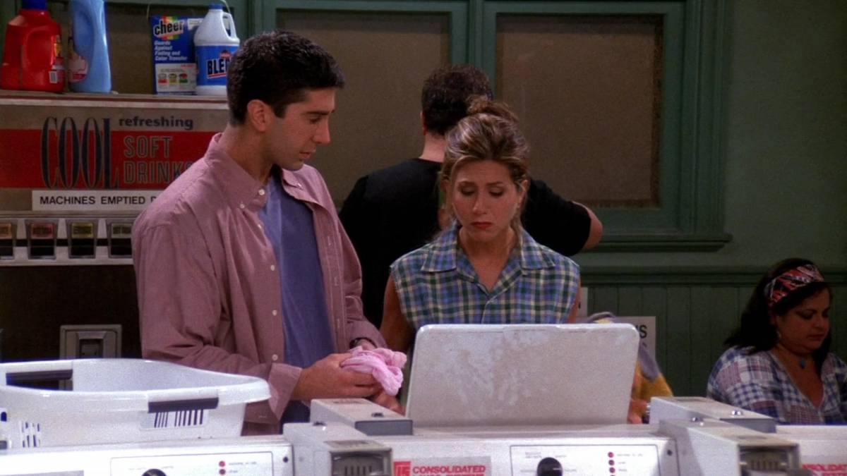 Ross and Rachel look into the washing machine at the laundromat, seeing how every item of her clothes is now pink.