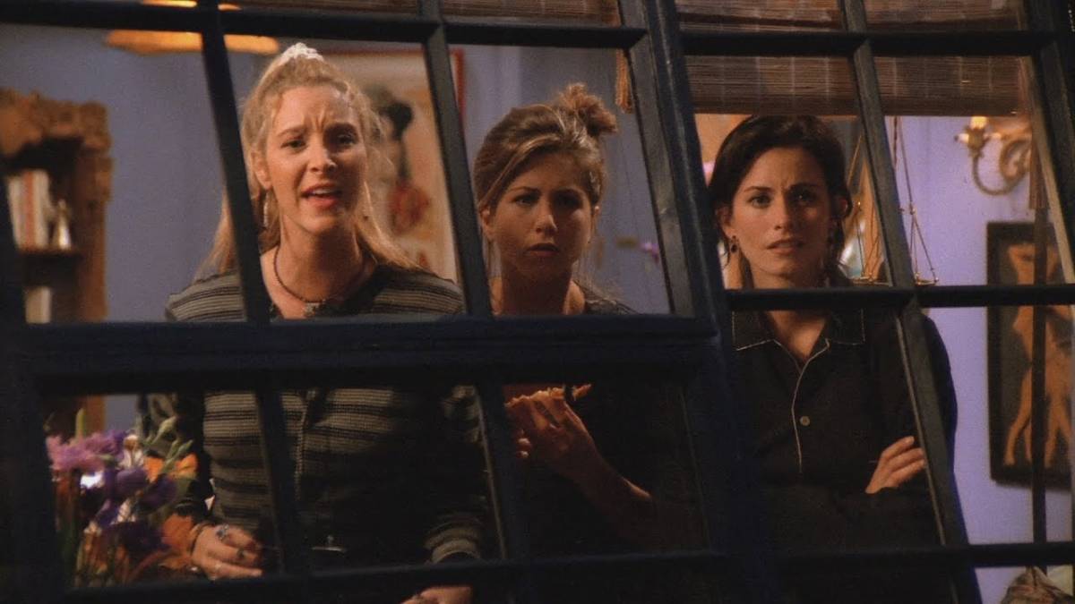 Phoebe, Rachel and Monica look out their window to try to catch a glimpse of George Stephanopoulos