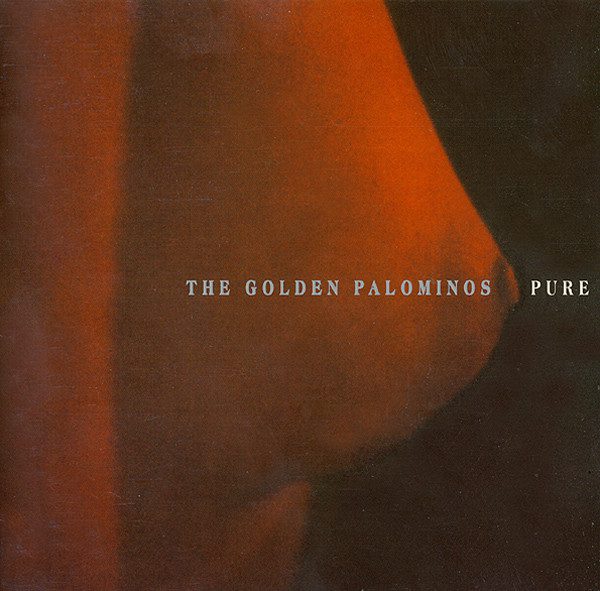 A close up profile of a female breast. The color filter is an orange. In line with the nipple are the words "The Golden Palominos Pure"