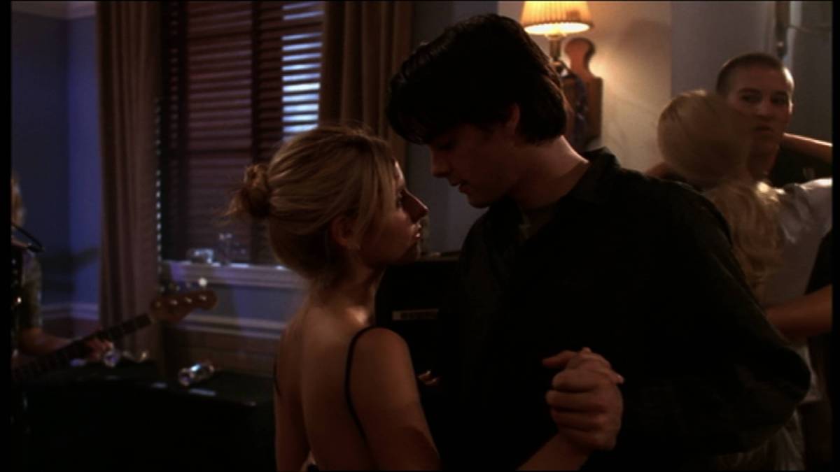 Buffy dances with Parker at a party.