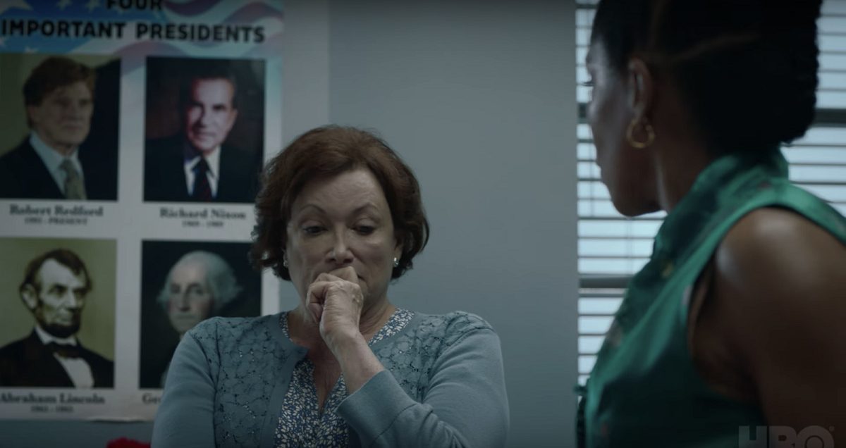 Angela talks to Topher's teacher, the "Important Presidents" poster in the background