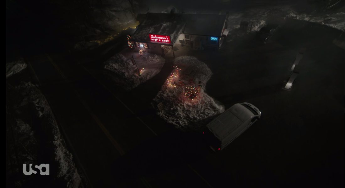An overhead shot of Salamano's Stop and Shop as the white van arrives