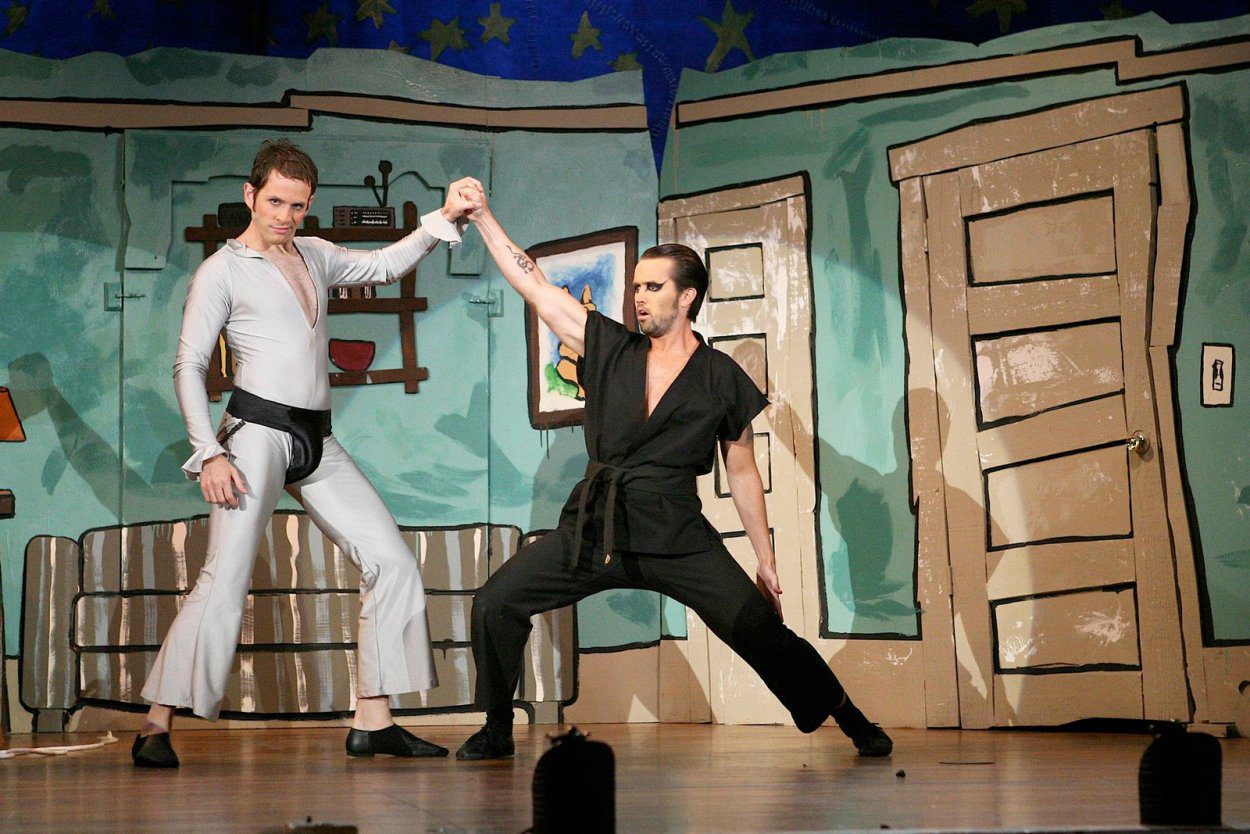 Dennis (The Dayman) fights Mac (The Nightman) on stage