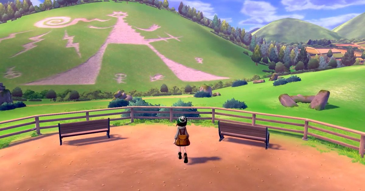 the player in pokemon sword and shield looking out onto a hill where a massive drawing was made thousands of years ago