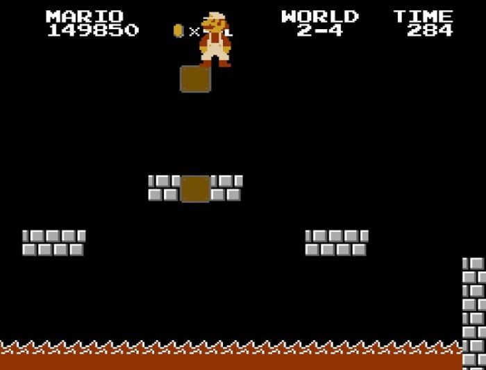 World 2-4: Mario stands over a lava pit in Bowser's second castle.