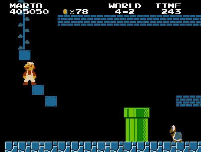 Super Mario strategically breaks some hidden blocks to reveal a beanstalk that leads to a Warp Zone.
