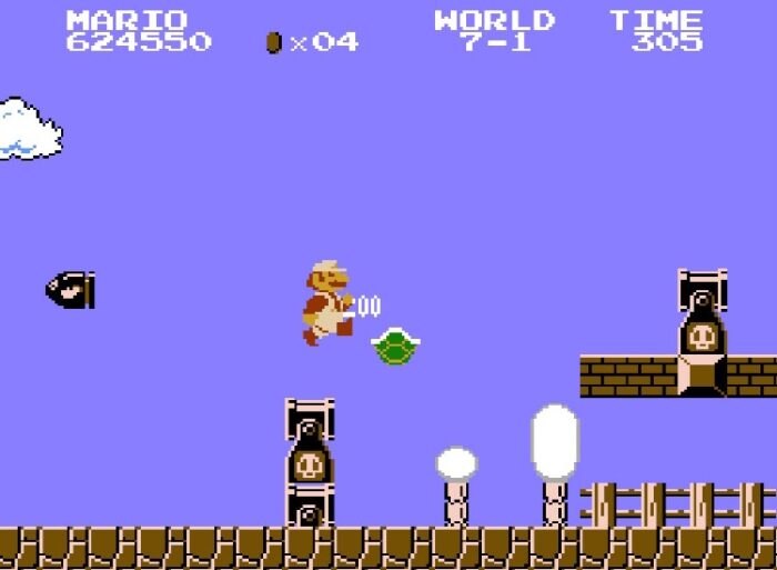 Super Mario kicks a turtle shell. Breakable bricks are nearby. Mario can go for them, but Bullet Bill cannons could fire at any moment.