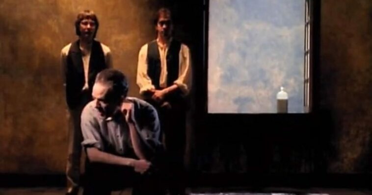 A still from the video of Losing My Religion. The band by a window.