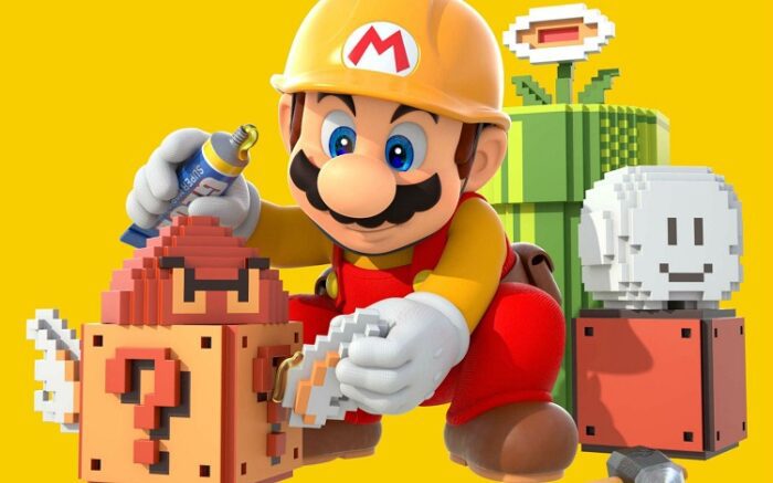 Super Mario Maker: Image features Mario in a yellow, monogrammed construction hat placing 8 bit Mario items