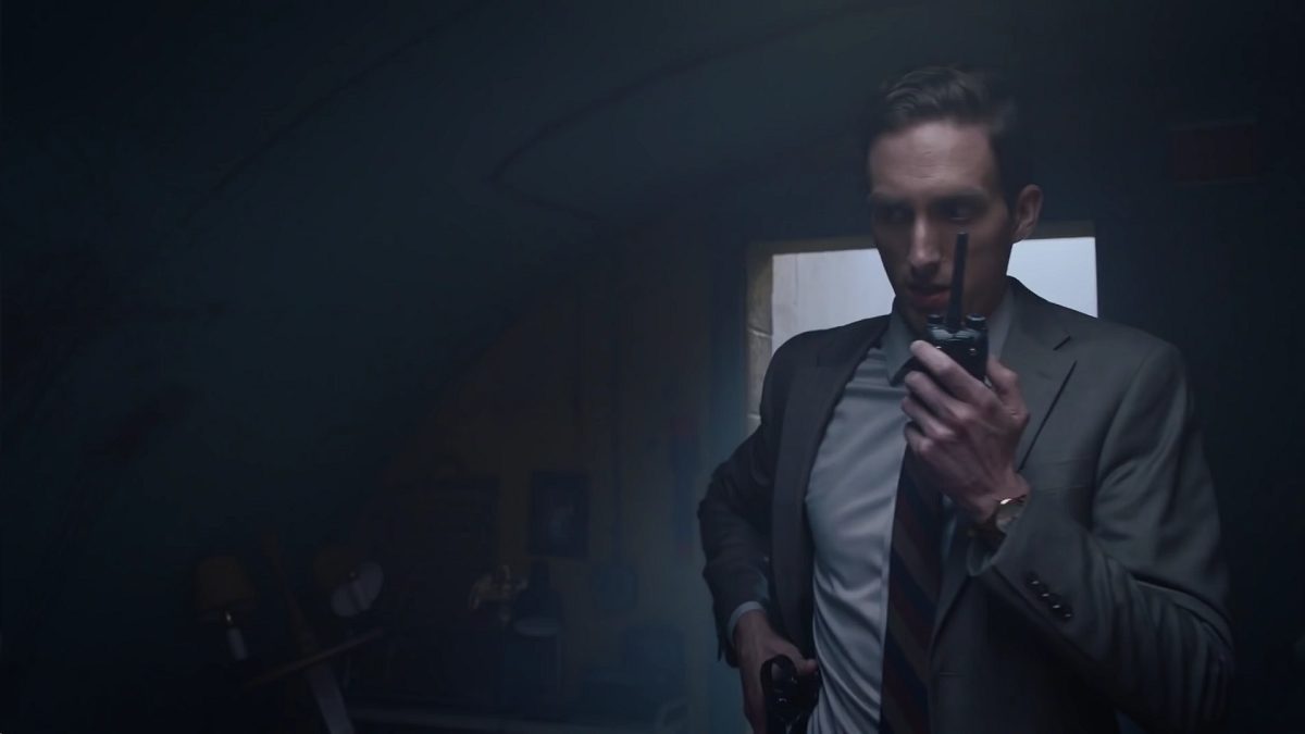 Watchmen - Agent Petey in an underground bunker talking into a walkie talkie