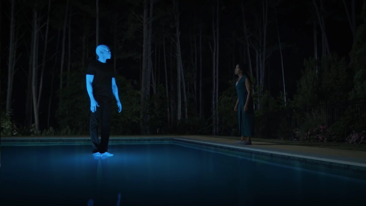 Watchmen - Cal, in glowing blue, is standing on the surface of a pool as Angela talks to him from the sidelines